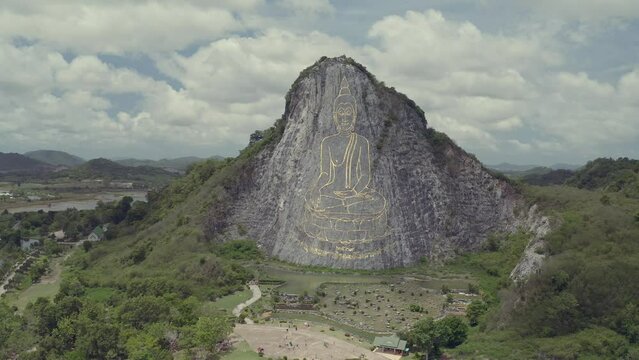 Buddha carved by laser on cliff, the major attractions of Pattaya at Khao Chi Chan Buddha, Pattaya, Chon Buri, Thailand