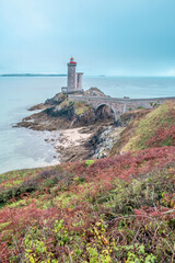 The lighthouse of Petit Minou, located on the coast of the Iroise Sea, is a maritime icon and a historical monument of Brittany. In Plouzane, Brittany, France - 781481515