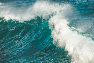 Close-up splashing, dropping ocean wave. Bali.