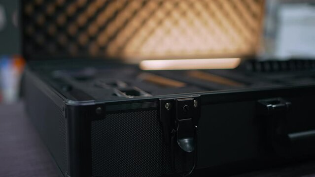 The working black suitcase has an automatic backlight that lights up when the suitcase is opened.