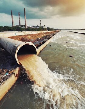 Environmental damage concept, Industrial and factory wastewater discharge pipe into the canal and sea, dirty water pollution, Sewage pipe outfall into the river, the river is polluted