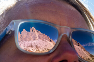 Reflection of Tre Cime di Lavadero in the Dolomite Mountains Italy in Hikers Glasses - Epic jagged...