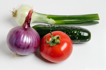 Onion, cucumber and tomato on white background