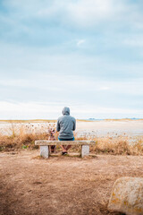 A young weimaraner dog waits for his human. Young boy sitting with his weimaraner dog waiting next...