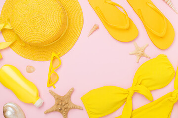 Flat lay with yellow summer outfit on color background. Vacation concept