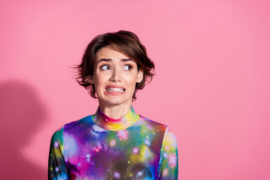 Photo of nice young woman grin teeth look empty space wear pullover isolated on pink color background