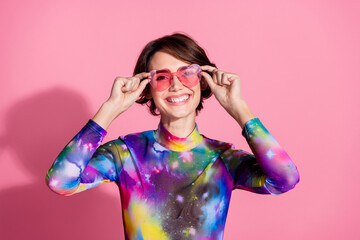 Photo of nice young woman touch sunglass wear pullover isolated on pink color background - obrazy, fototapety, plakaty