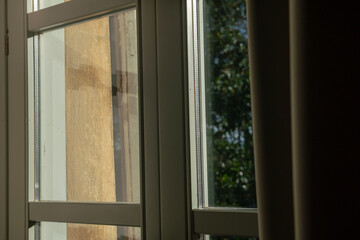 double glazed window with light and transparency effects, the solar reflections highlight the structure of the window and its particular important element for a home.