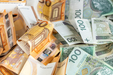 Polish zloty and euro, 50 euro and 100 zloty banknotes, Currency rates, Euro zone and Poland, Financial concept, Foreign trade