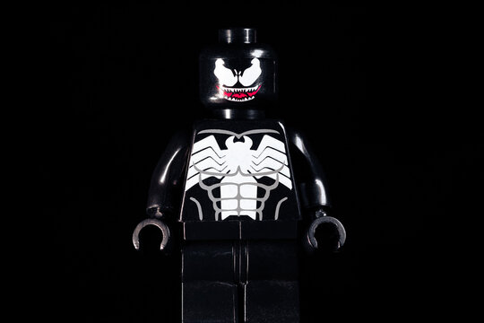 LEGO Marvel Venom with scary smile on a black background