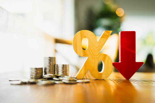 Percentage model, coin stack and down arrow, concepts for success, methods, systems of raising or lowering Fed interest rates to correct inflation concepts.