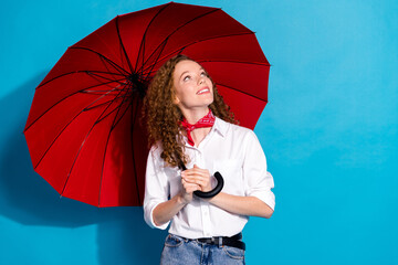 Photo portrait of nice young lady look empty space hold red umbrella wear trendy white garment...