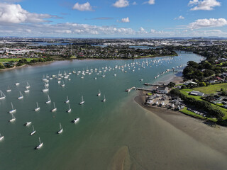 Panoramic view of boats on the Tamaki river at sunset in Auckland, NZ