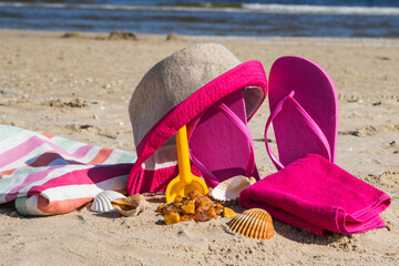 Different accessories for relax on sand at beach. Summer time