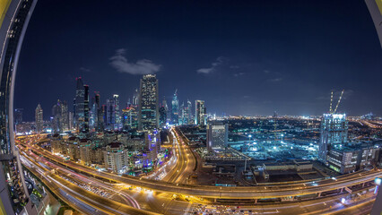 Fototapeta na wymiar Skyscrapers aerial view in downtown and financial district Dubai night timelapse, United Arab Emirates