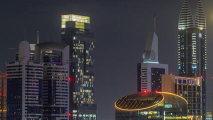 Skyscrapers aerial view in downtown and financial district Dubai night timelapse, United Arab...