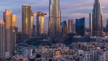 Dubai Downtown skyline during sunrise timelapse with Burj Khalifa and other towers panoramic view from the top in Dubai