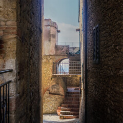 The old narrow streets in the medieval town of Casale Marissimo in Tuscany shot with analogue film technique