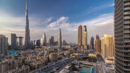 Dubai Downtown skyline day to night timelapse with Burj Khalifa and other towers paniramic view...