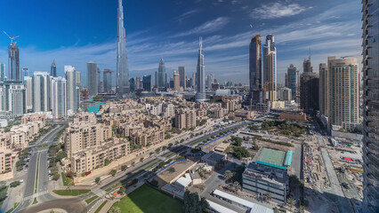 Dubai Downtown skyline timelapse with Burj Khalifa and other towers panoramic view from the top in...
