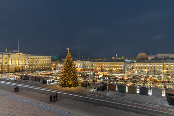 Shopping at the illuminated Christmas Market in the Helsinki Senate Square