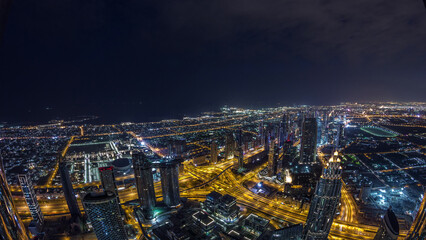 Obraz premium Downtown of Dubai night to day timelapse before sunrise. Aerial view with towers and skyscrapers