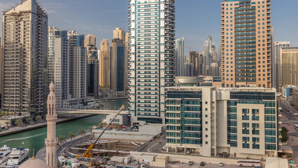 Fototapeta na wymiar Dubai Marina skyscrapers, port with luxury yachts and Marina promenade aerial timelapse, Dubai, United Arab Emirates
