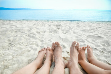 beautiful legs in the sand of the sea greece background - 781532132