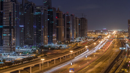 Aerial top view to Sheikh Zayed road near Dubai Marina and JLT night to day timelapse, Dubai.