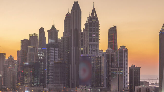 Dubai Marina skyscrapers and golf course day to night timelapse, Dubai, United Arab Emirates