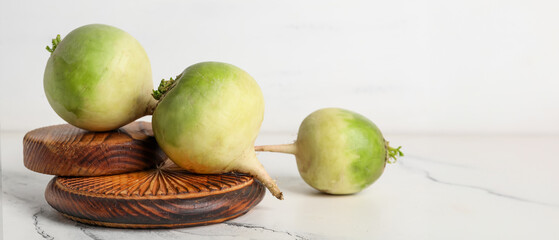Wooden boards with ripe watermelon radishes on white background