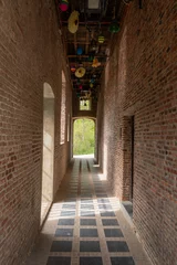 Deurstickers walkway through the Spui Groot Spui, former lock house on the Binnennete in Lier Belgium. Historic building landmark part of original town walls for fortification and protection of water level,  © drew