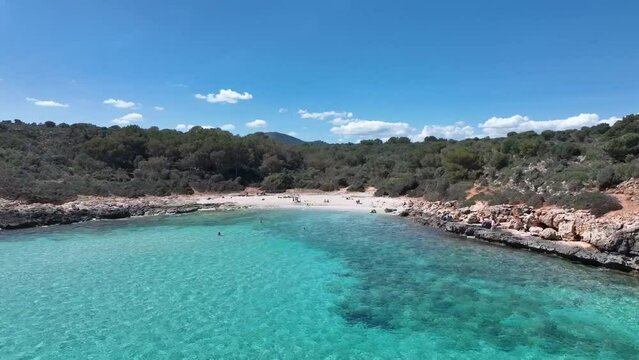 Mallorca Spain  beautiful sunset, life style, blue water, beach and rock coast, mediterranean sea, sunsets and from the sky with a drone, boat at the beach