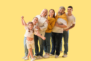 Big family on yellow background - obrazy, fototapety, plakaty