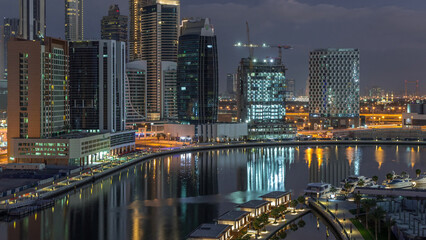 Fototapeta na wymiar The rhythm of the city of Dubai from night to morning aerial timelapse