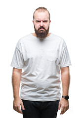 Young caucasian hipster man wearing casual t-shirt over isolated background skeptic and nervous, frowning upset because of problem. Negative person.