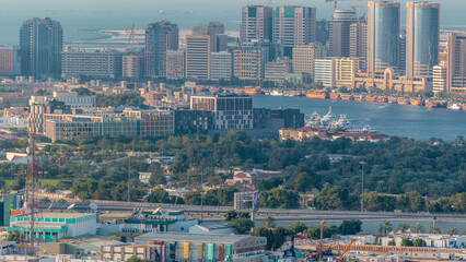 Obraz premium Aerial view of modern city of Dubai with blue sky aerial timelapse