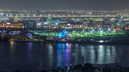 The rhythm of the city with lights from buildings and illuminated roads aerial timelapse