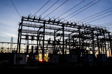 Silhouette of substation for the distribution of electric power with  in Brazil, with sundown...
