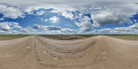 blue sky hdri 360 panorama with awesome clouds on gravel road among fields in spring day in equirectangular full seamless spherical projection, for VR AR content or skydome replacement