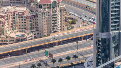 Aerial view of highway interchange in Dubai downtown evening timelapse.