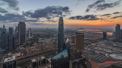 Amazing sunrise aerial view of Dubai downtown skyscrapers morning timelapse, Dubai, United Arab...