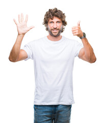 Handsome hispanic model man over isolated background showing and pointing up with fingers number six while smiling confident and happy.