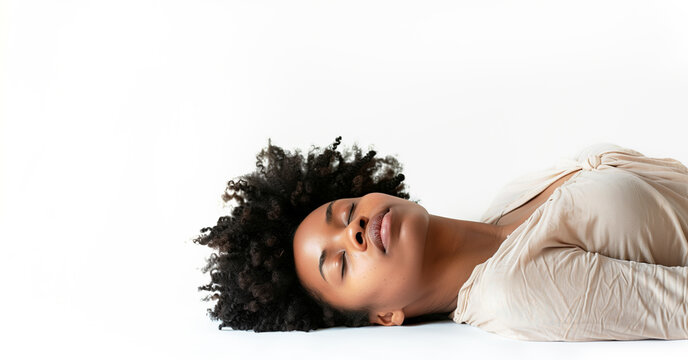 Black African american Woman Sleeping concept. Eyes closed. White shirt. Big breast. Laying on the isolated white background. Can also represent Fainted, dead, relaxed, relaxation, drunk.