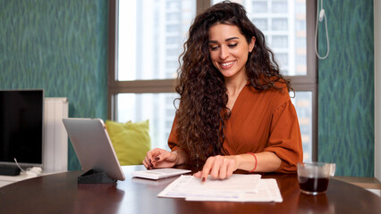 Woman calculating her monthly costs