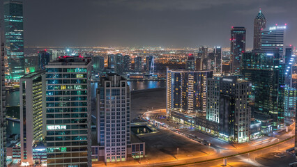 Fototapeta na wymiar Dubai's business bay towers aerial night timelapse.