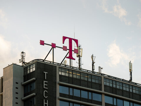 BERLIN, GERMANY - 16. March 2024: Deutsche Telekom logo sign on the so called Telefunken Hochhaus (high rise building) in Charlottenburg. Big German telecommunication and technology company.