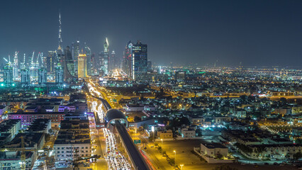 Dubai skyline with beautiful city center lights and Sheikh Zayed road traffic night timelapse,...