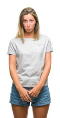 Obraz premium Young beautiful woman over isolated background depressed and worry for distress, crying angry and afraid. Sad expression.
