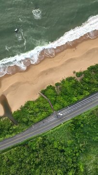 Guarda do Embaú Beach located in the state of Santa Catarina near Florianopolis. Aerial image of beach in Brazil. Vertical video.